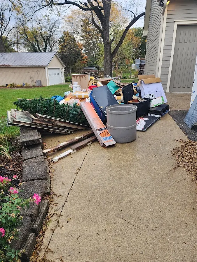 Dumpster being loaded with debris for Estate Cleanout Dumpster Rental in Westville